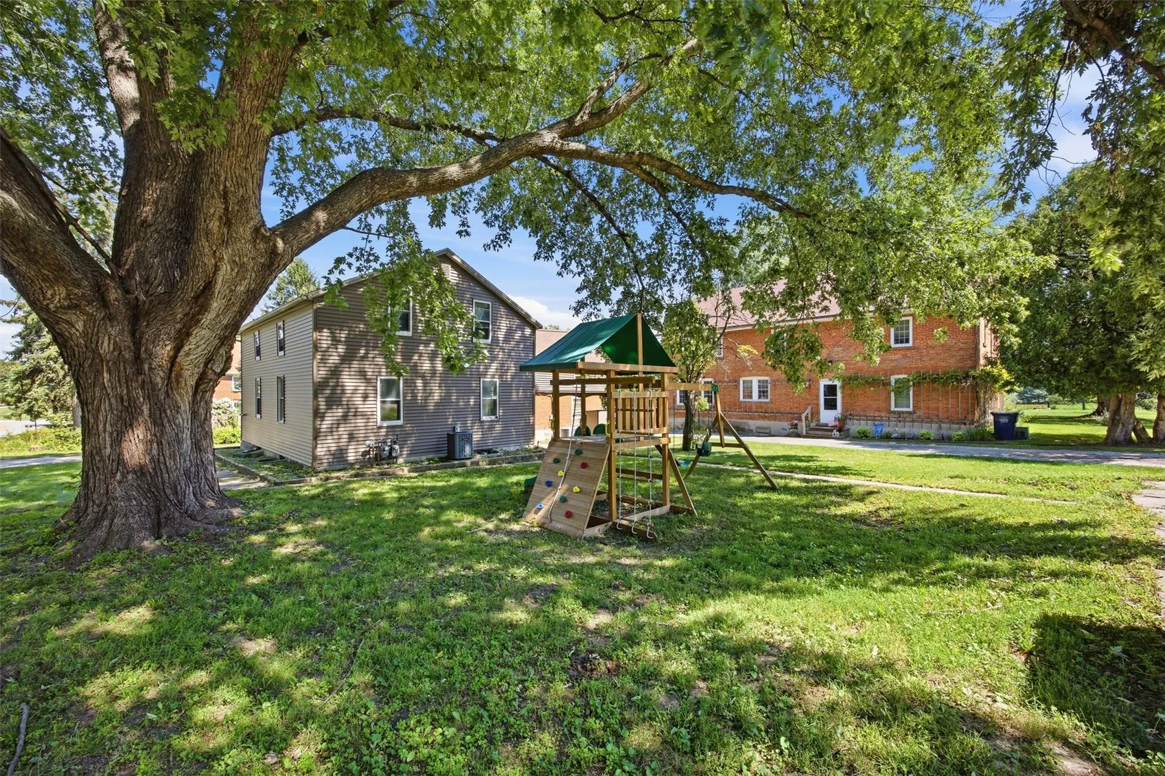 New wooden playset w/mature tree shade