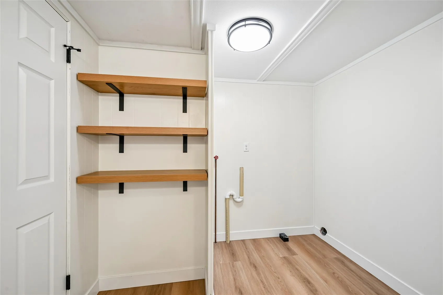 Attractive shelving & main level laundry space
