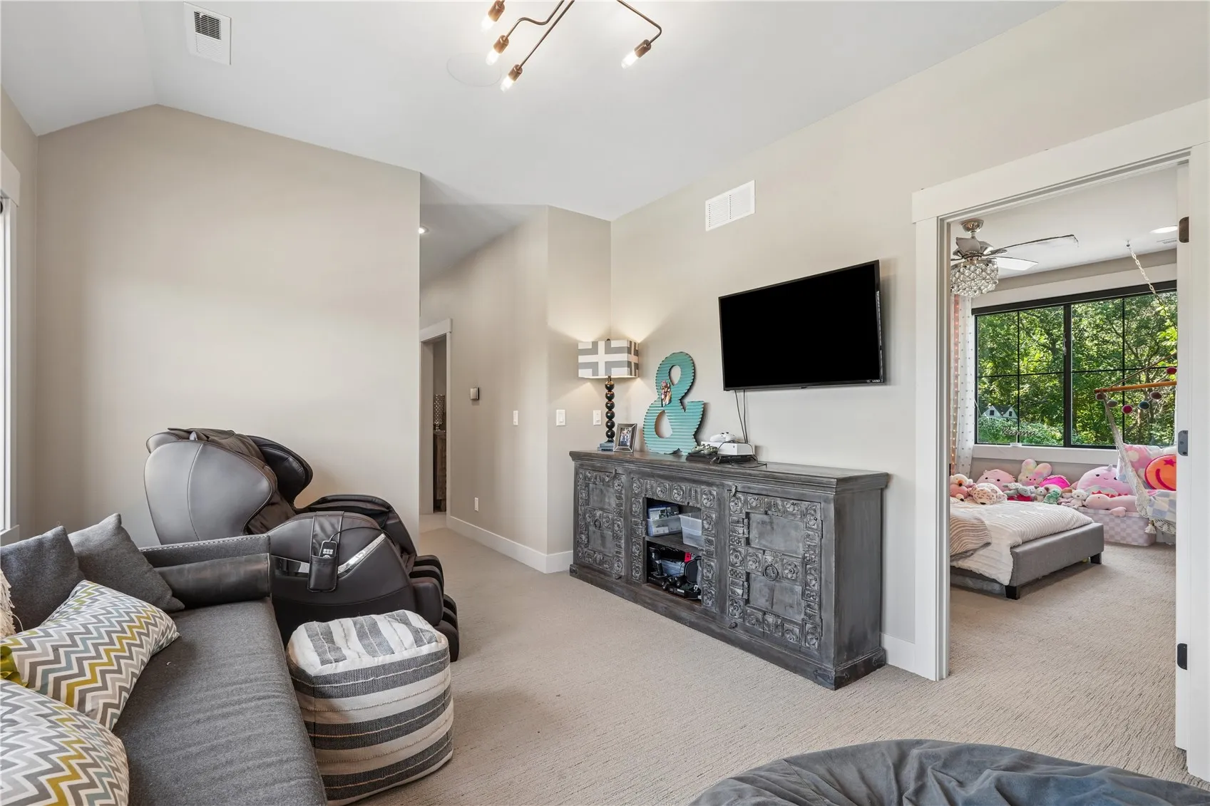 Upstairs designated sitting area is next to two of the upper bedrooms and the full bath is just steps away.