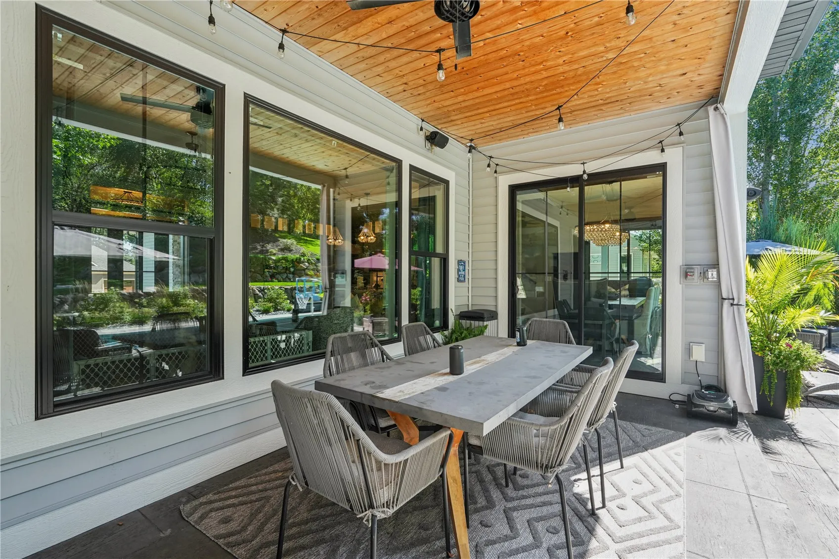 Covered Porch/Patio off Dining Area and adjacent to the pool