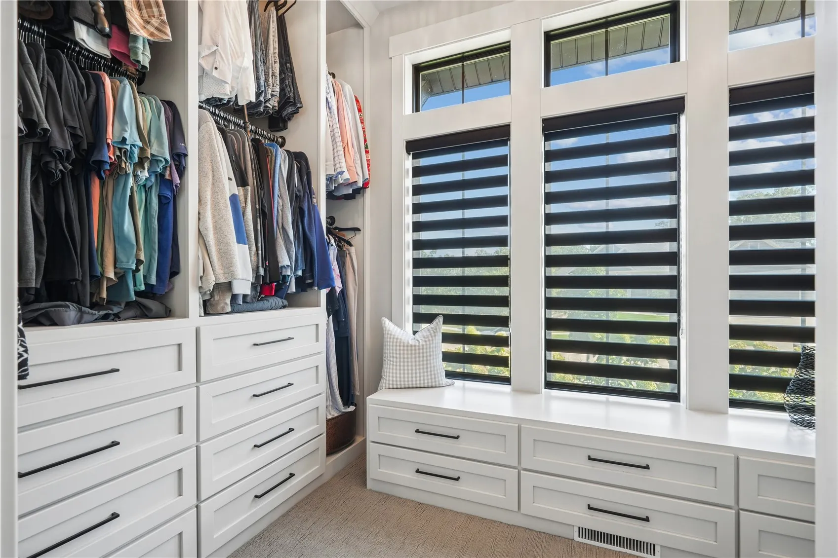 The custom designed walk-in closet is jaw dropping.
