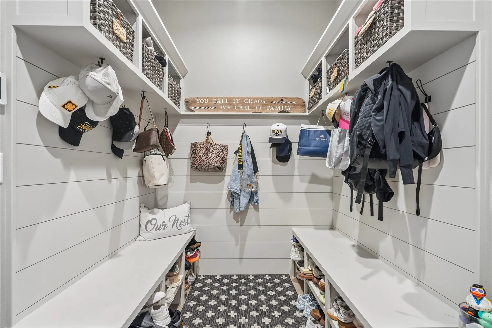 Mudroom with built in lockers and benches. There is also a nice walk-in closet.