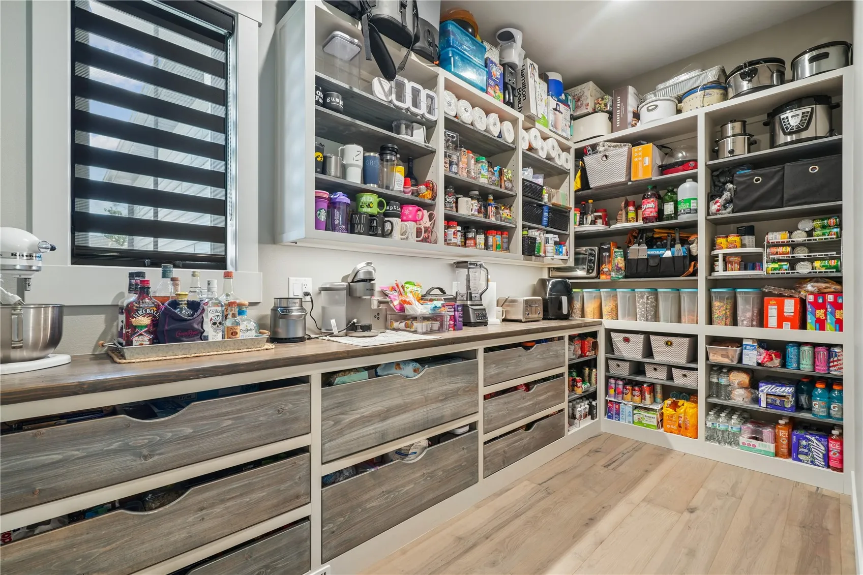 Wow! Look at the size and features in this hidden walk-in pantry. As if the kitchen doesn't have an abundance of storage!