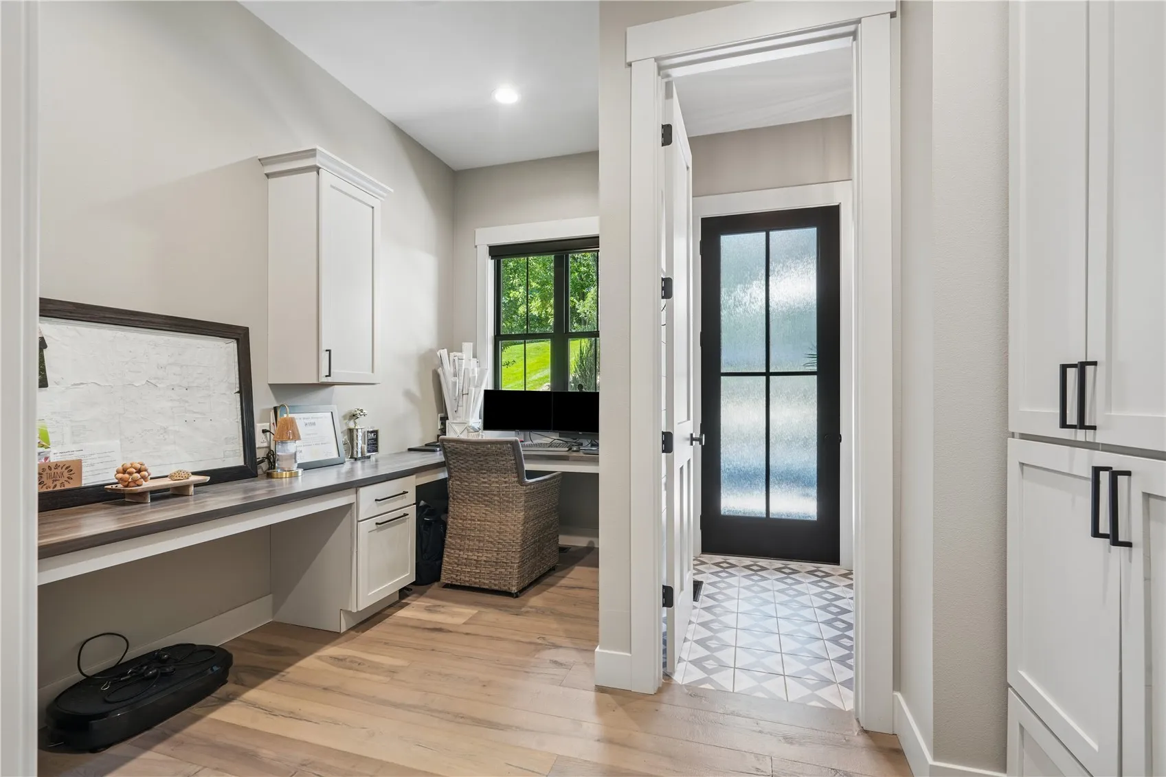 Main floor office with built-ins and access to one of the half baths.