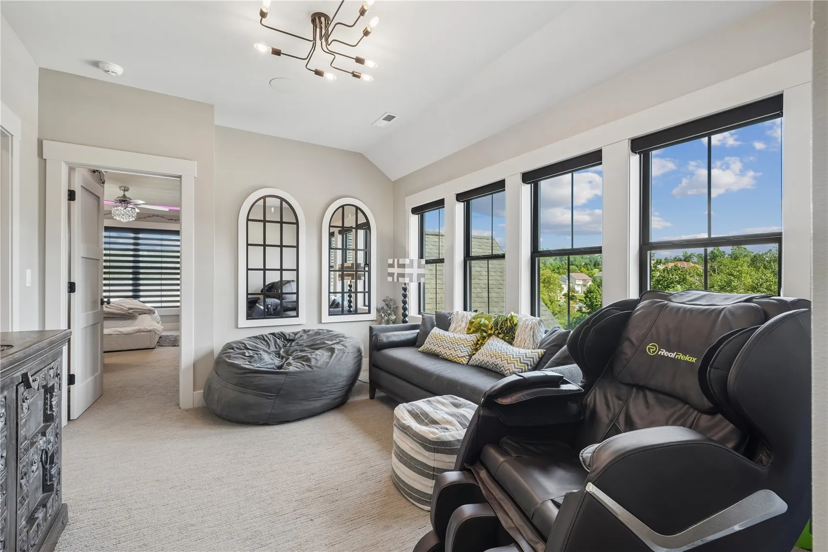 Upstairs sitting area with custom blinds. Just look at those windows and the great view. Relax with a good book or do some gaming or catch a movie. 9ft ceilings throughout the second floor.