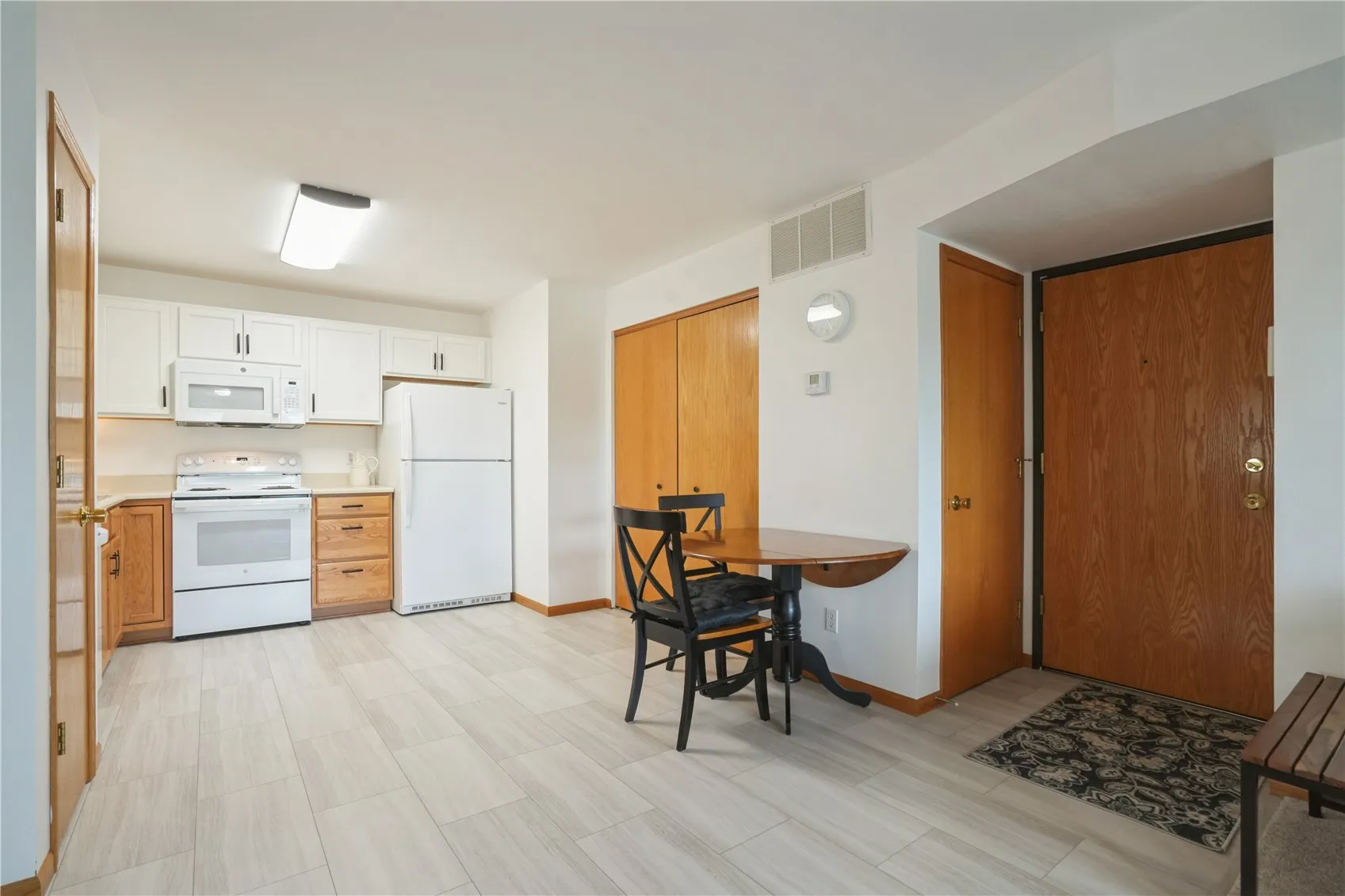 Entryway has front coat closet