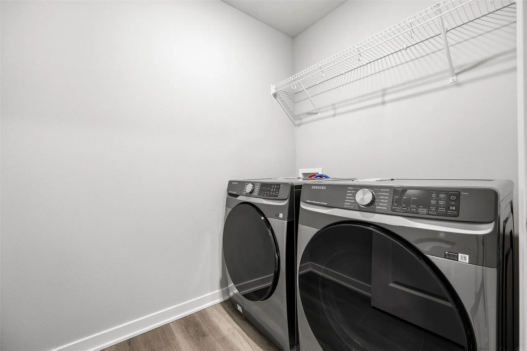 Main level laundry room -- Samsung Smart washer/dryer included with the sale
