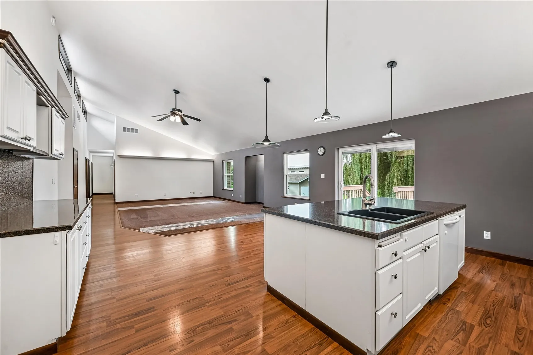 Sun-drenched room featuring expansive windows and natural lighting.