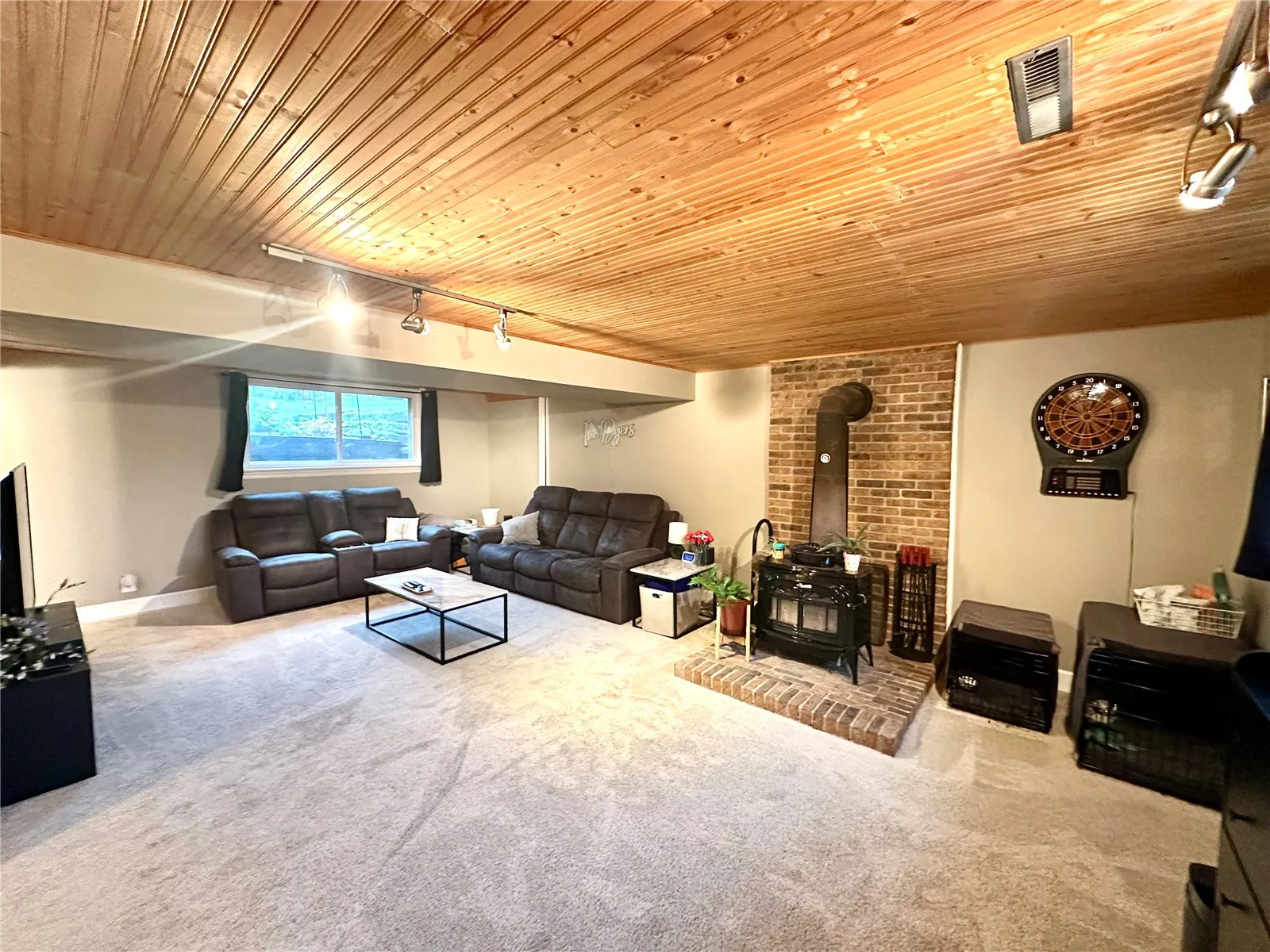 Lower-level Rec Room with wood burning stove.