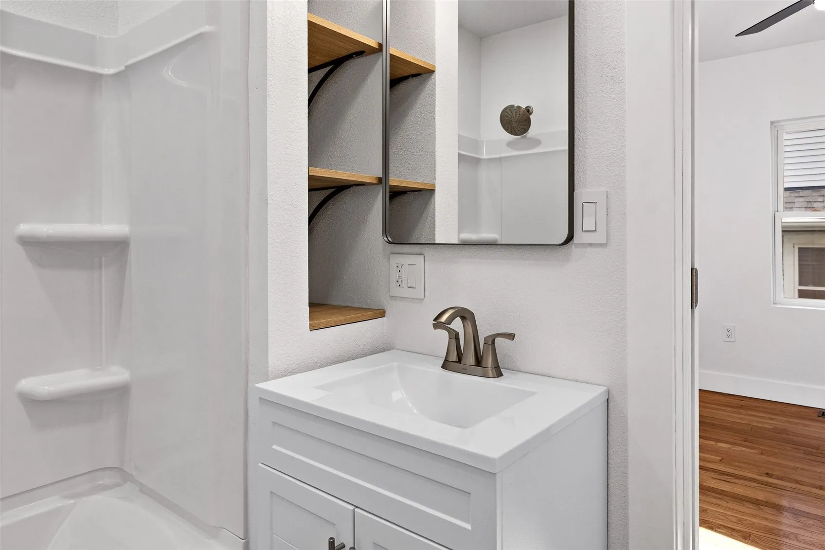 All new and clean bathroom fixtures with added storage