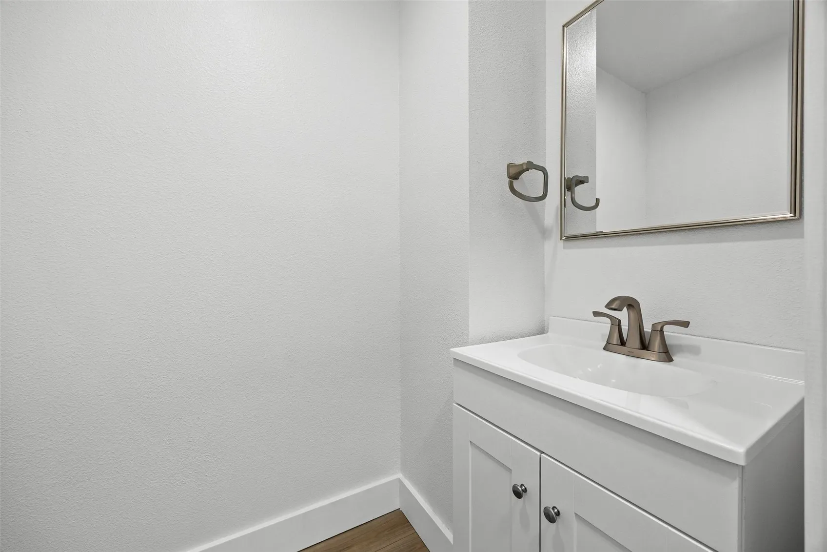 Newly added powder room off the kitchen before laundry