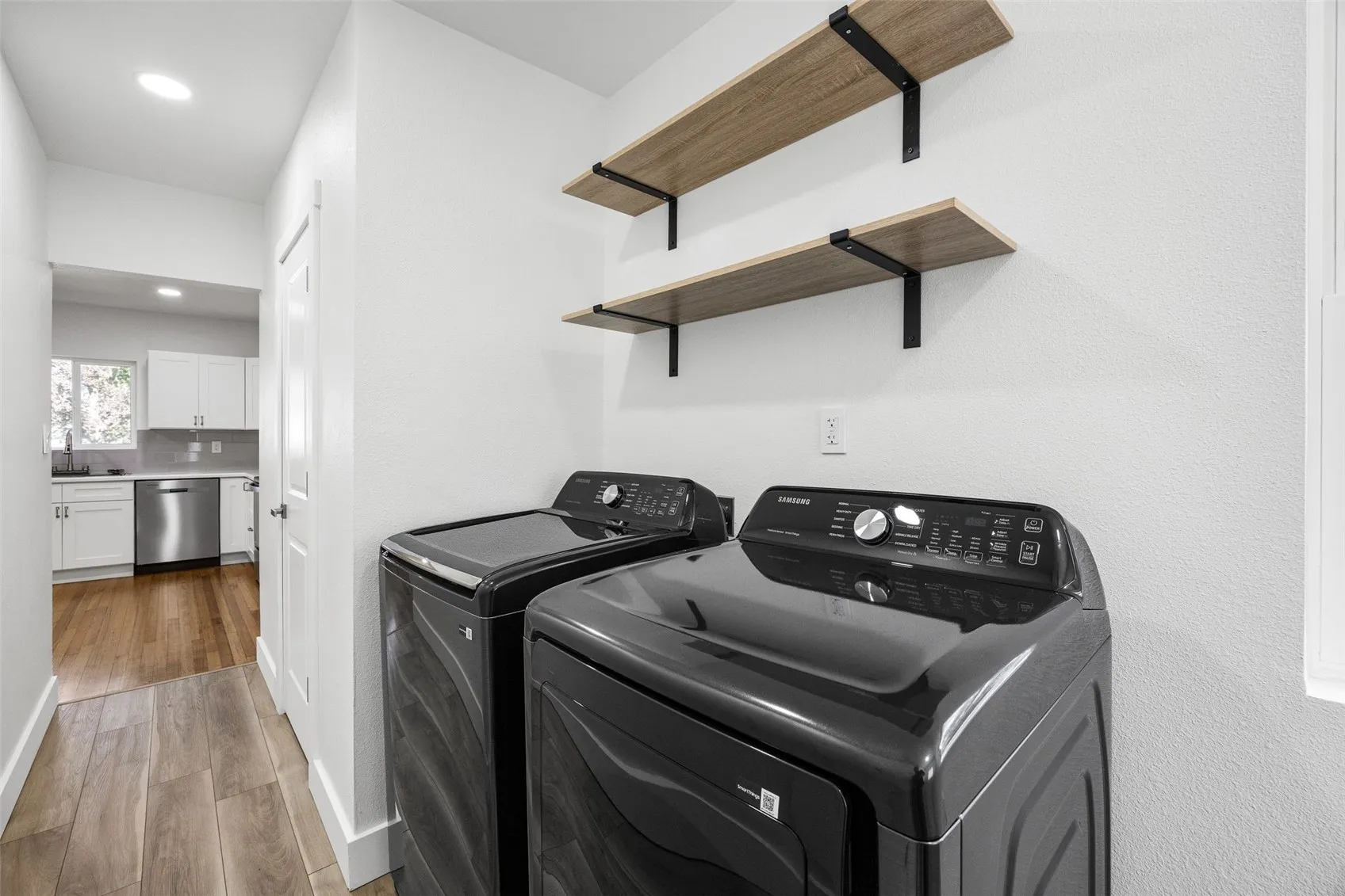 Laundry on 1st floor of home behind kitchen