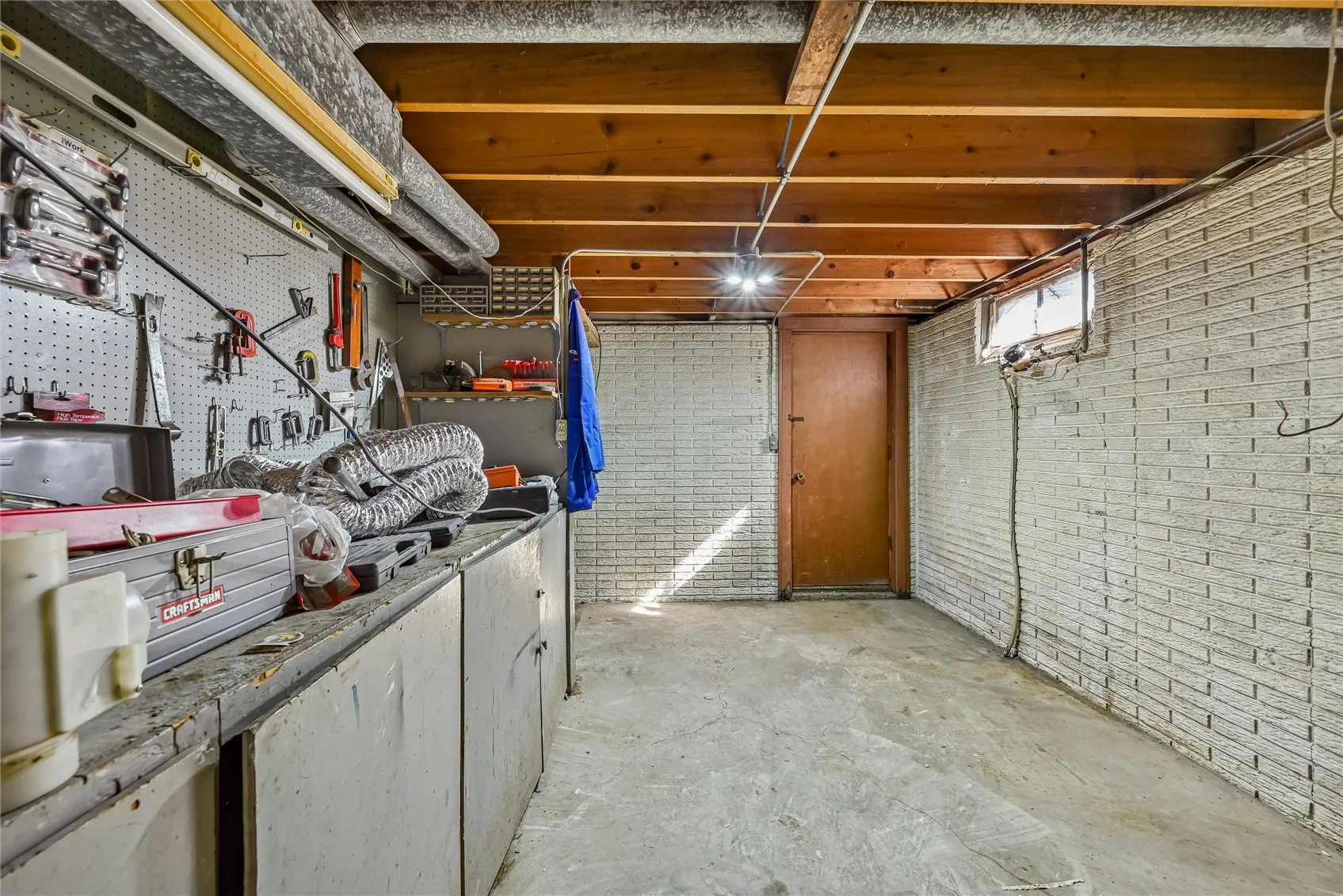 workshop area in basement leads to garage.