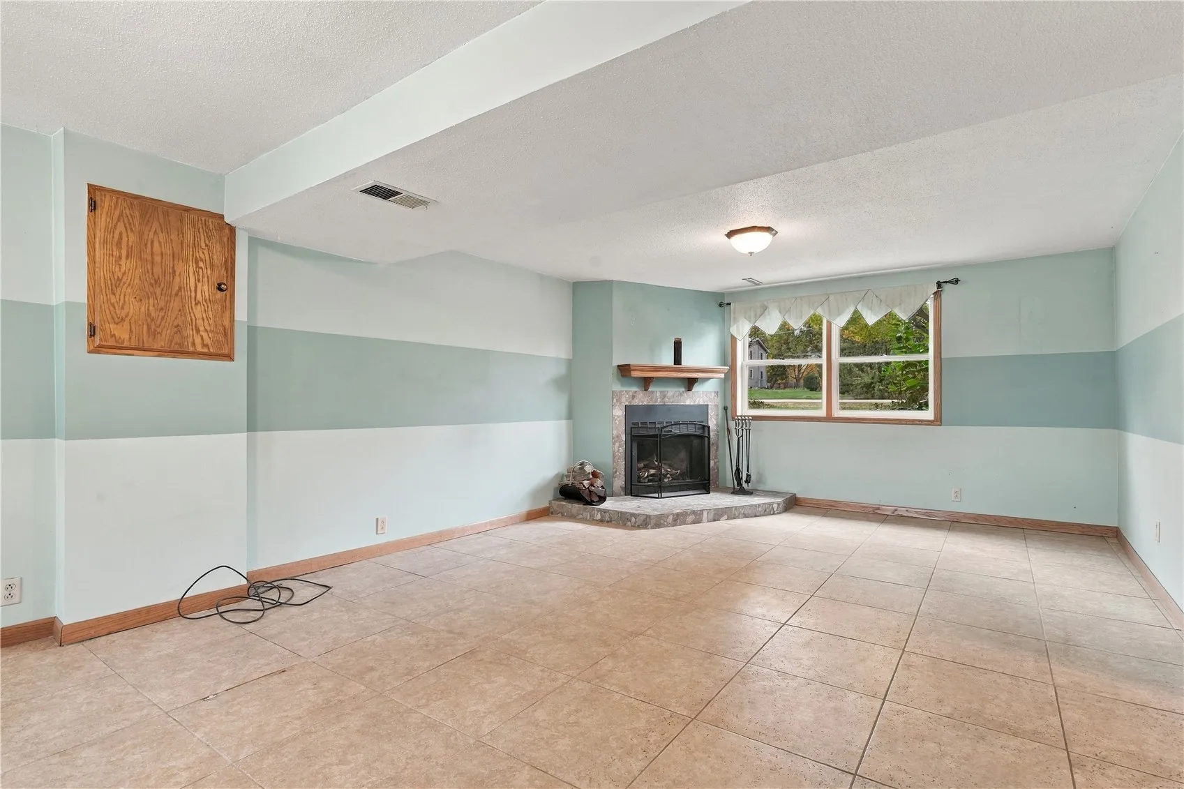 Family room w/ wood burning fireplace