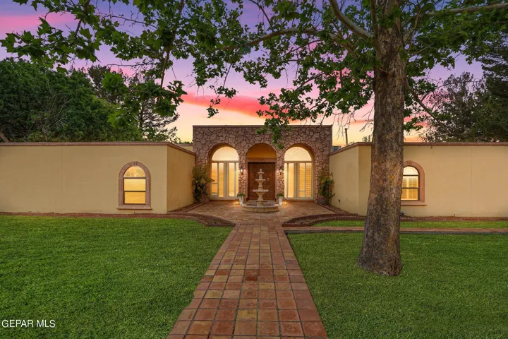Spectacular Spanish Mediterranean Exterior with gorgeous lush surrounding landscape