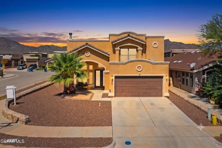 This spacious custom home offers 4 bedrooms, 3 bathrooms, multiple living areas, and 2,638 square feet of beautifully designed living space.