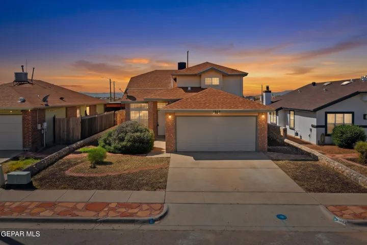 Beautiful 2-story brick home featuring 3 beds, 2.5 baths, spacious living areas, wood flooring, vaulted ceilings, and a functional layout.