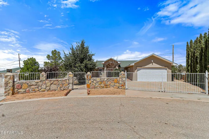 Primary view of home. Rock wall fence. HALF ACRE LOT.