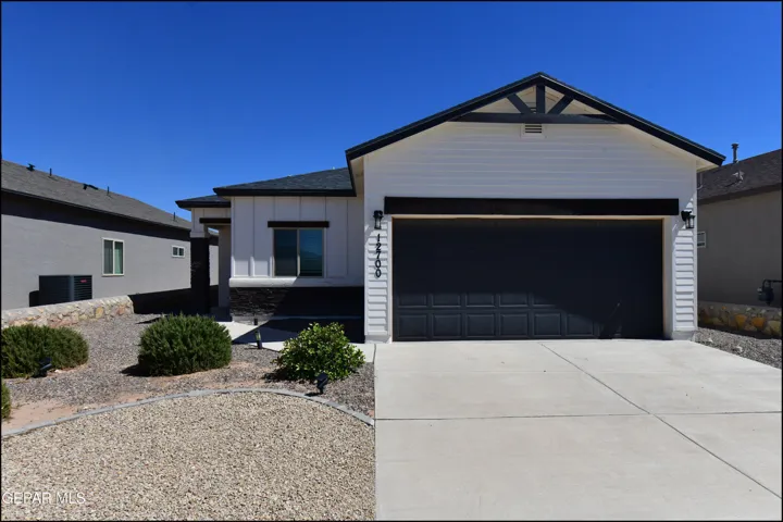 Contemporary exterior with white horizontal siding and black trim accents
