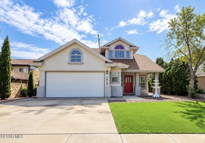 Front view of the two-story home with landscaped yard. Digitally enhanced.