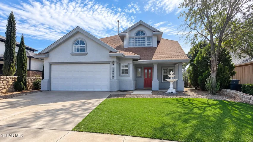 Additional view of the home's exterior and front lawn. Digitally enhanced