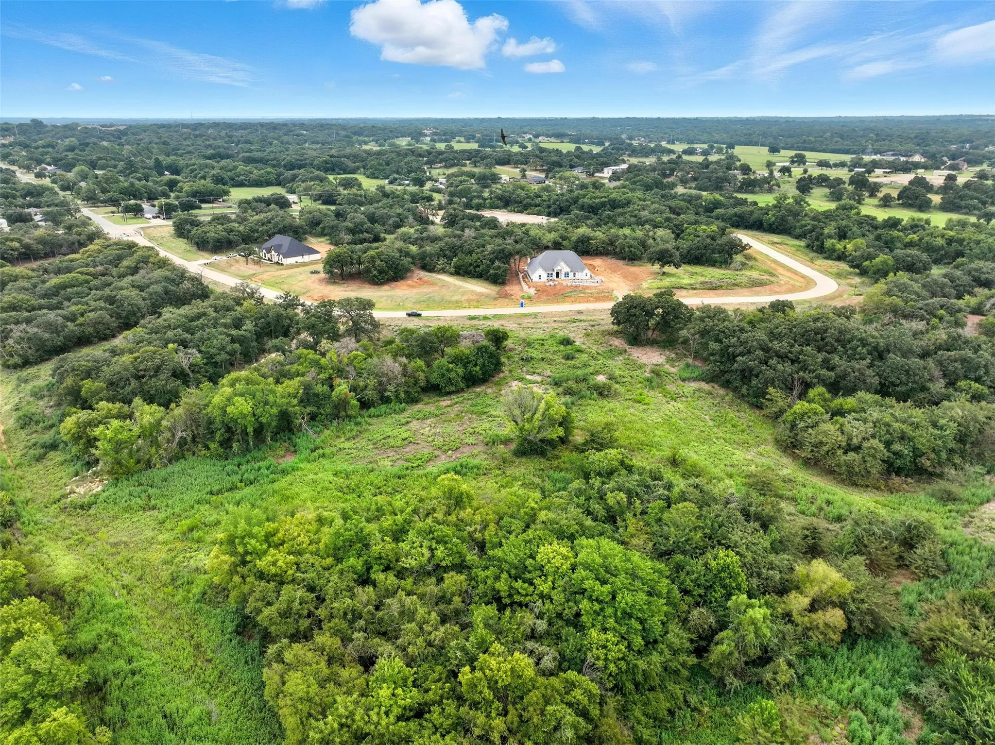 Drone / aerial view of a heavily wooded area