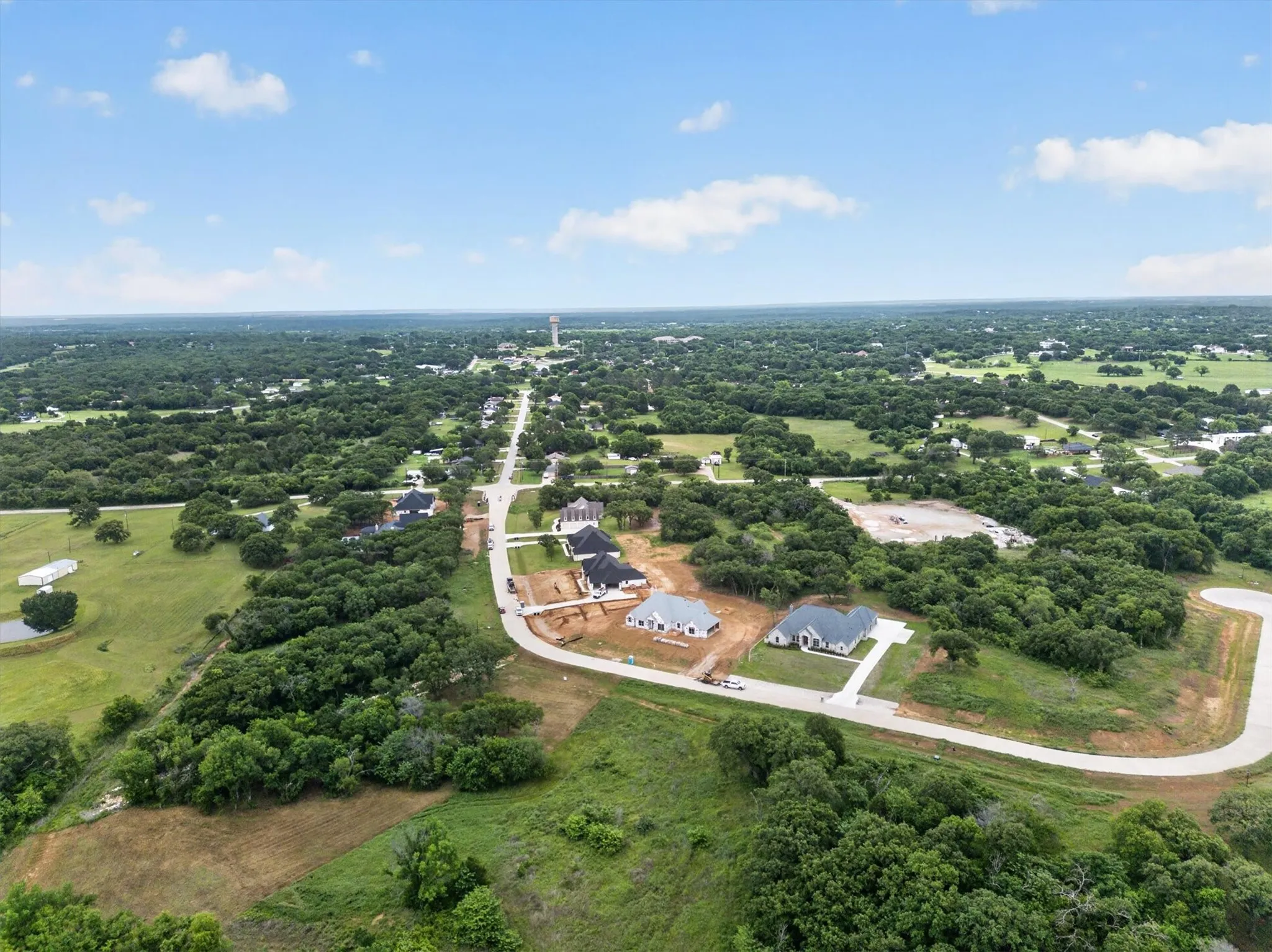 Aerial perspective showcasing a developing residential area with multiple properties under construction