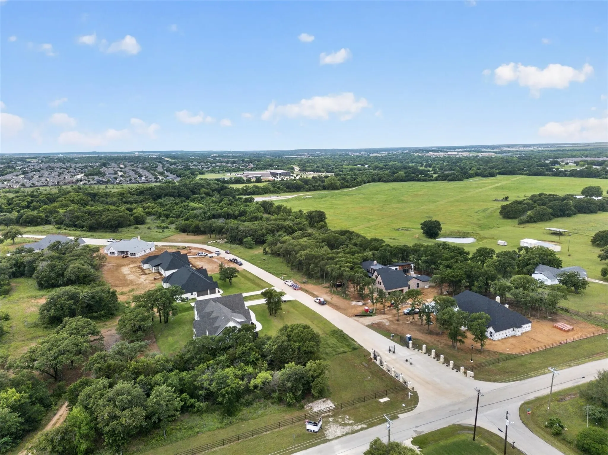 Aerial perspective showcasing a developing residential area with multiple properties under construction