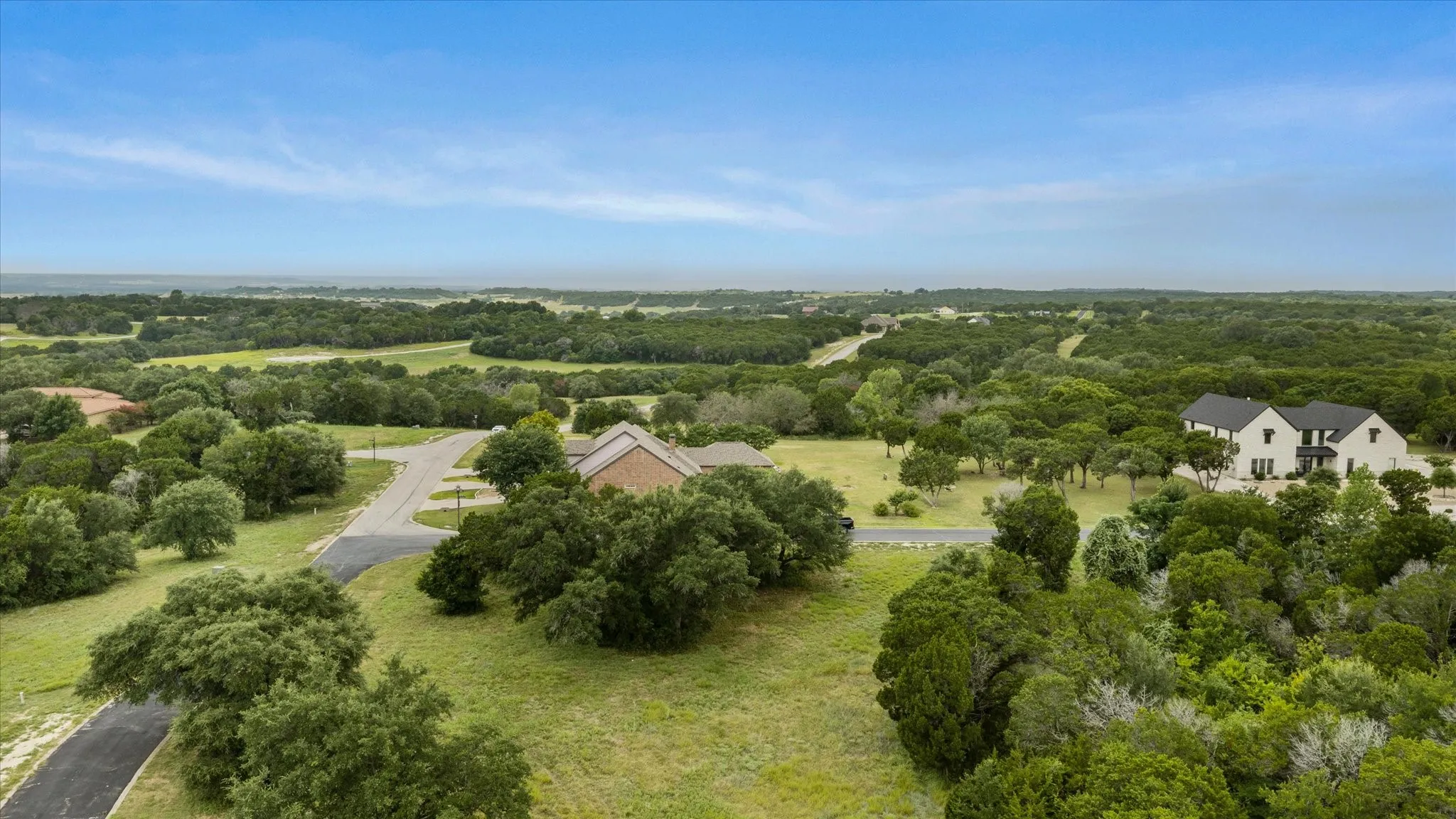 Expansive natural landscape featuring lush green trees and rolling terrain