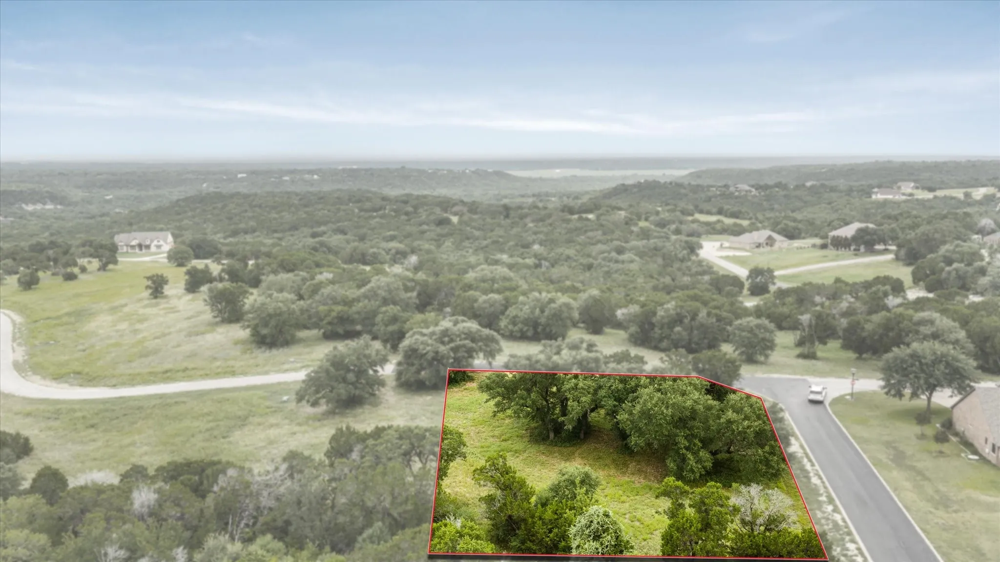 Wooded lot featuring mature trees and established greenery