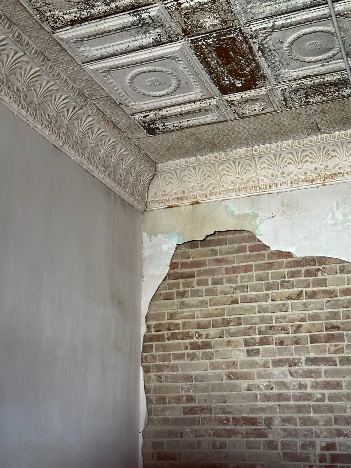 Brick & plaster wall, tin ceiling tiles