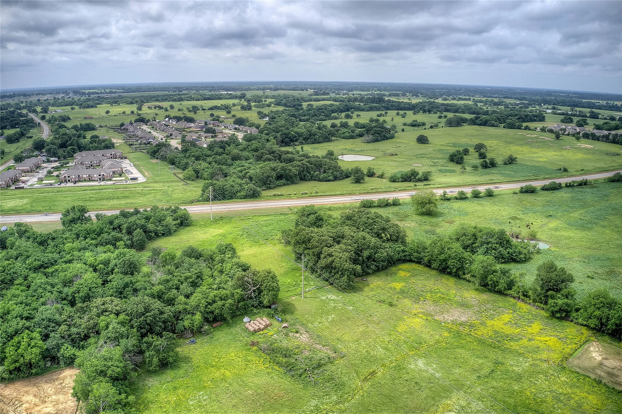 Birds eye view of property with a rural view