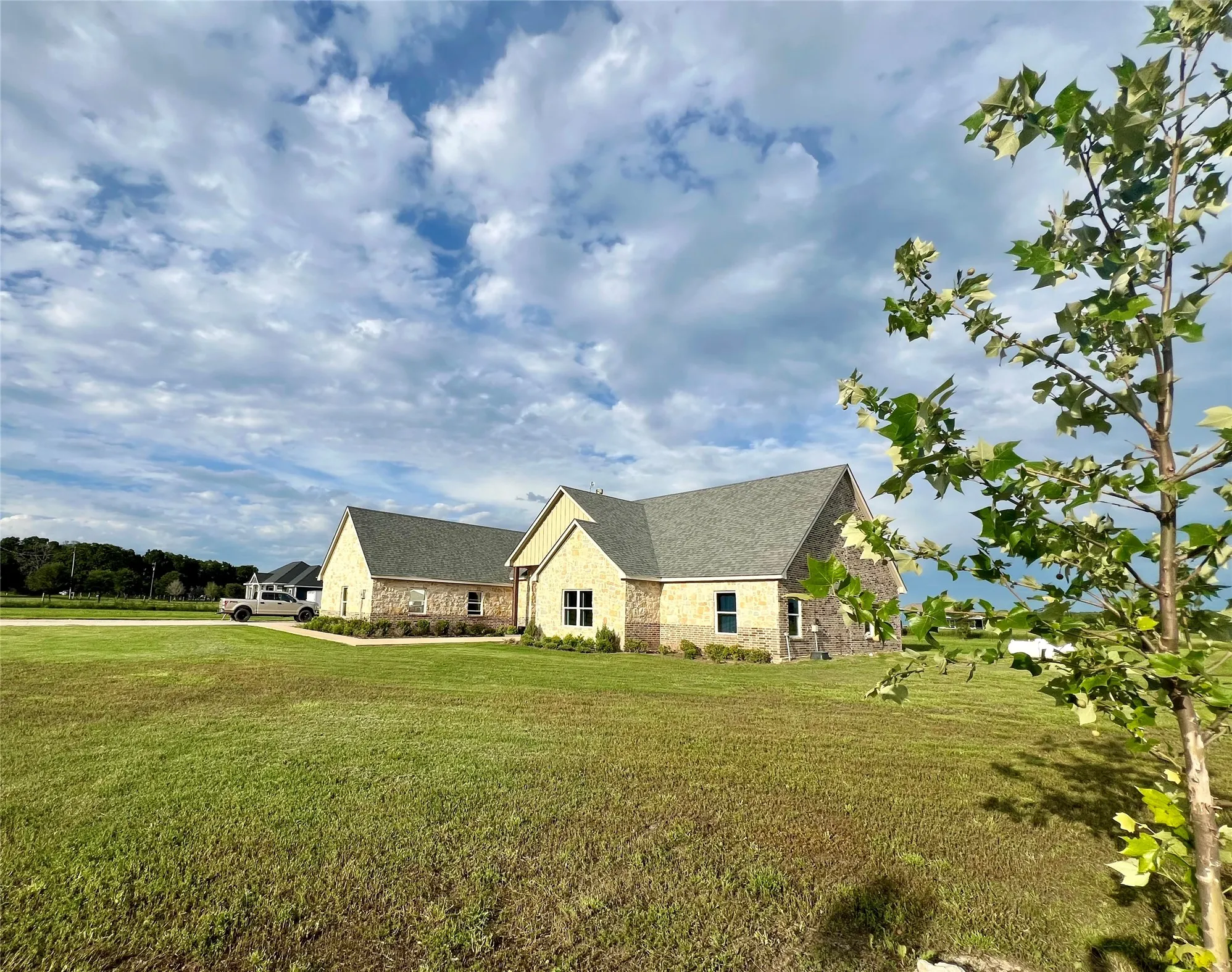View of home's exterior with a yard