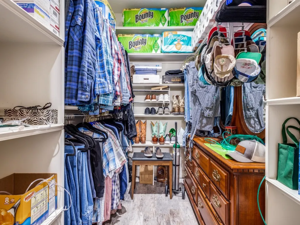 Spacious closet with hardwood / wood-style flooring