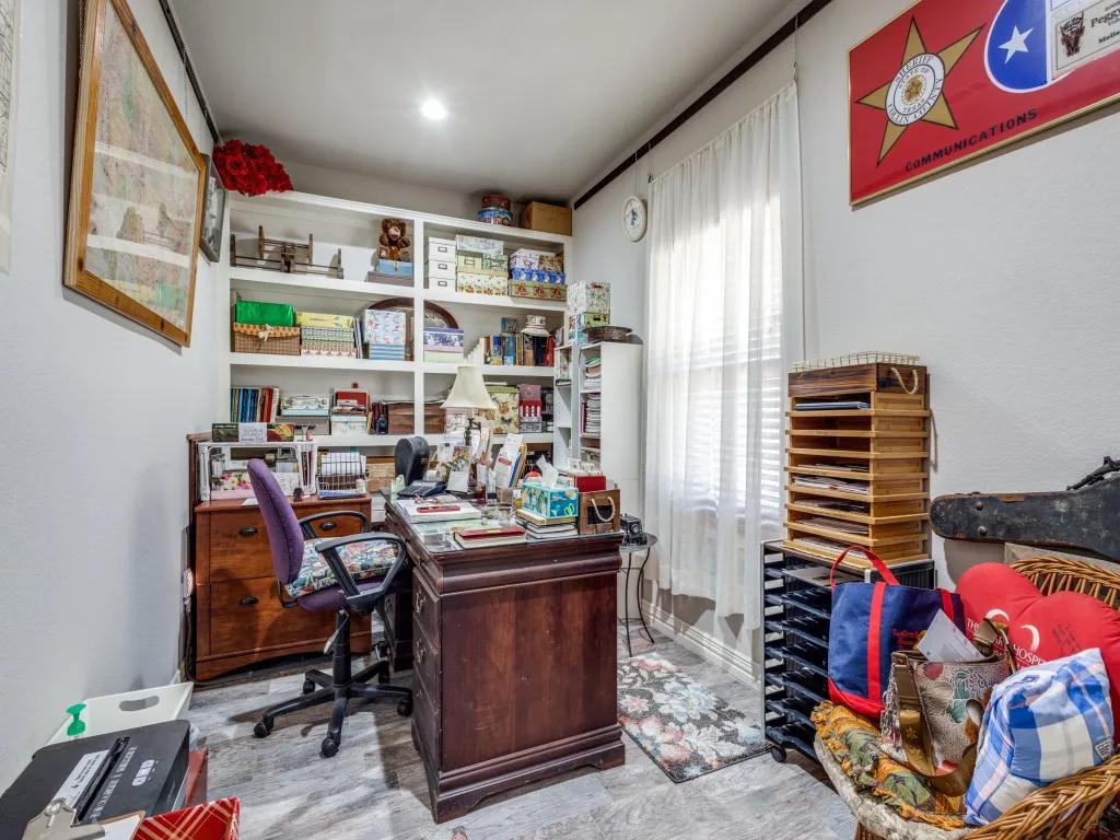 Home office with light hardwood / wood-style floors