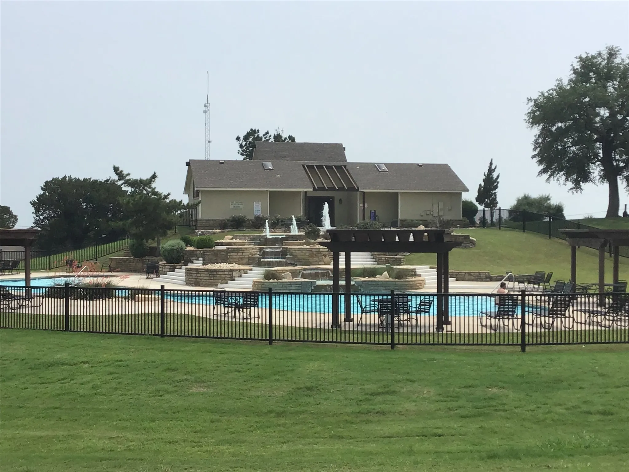 View of swimming pool featuring a yard