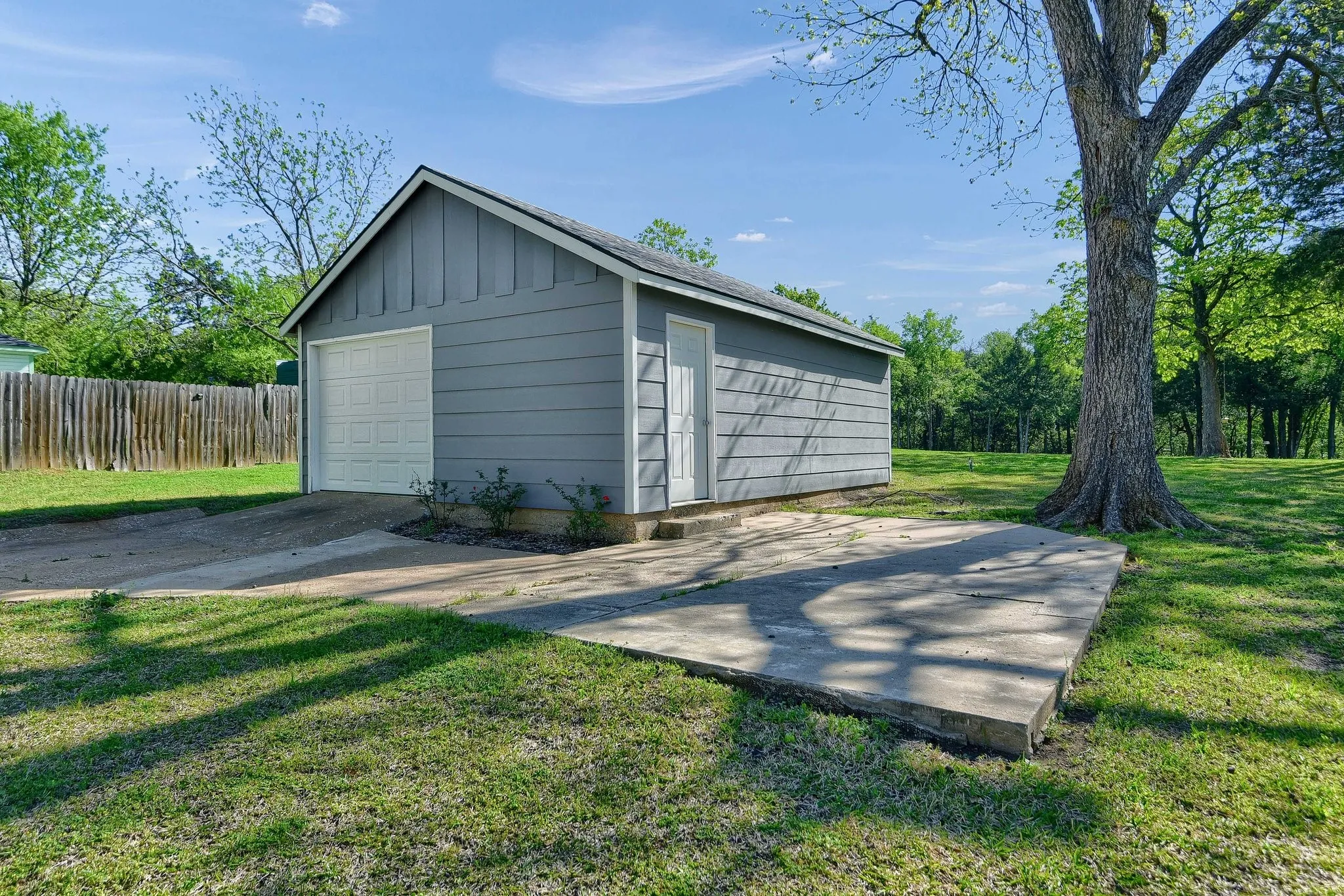 Garage featuring a yard