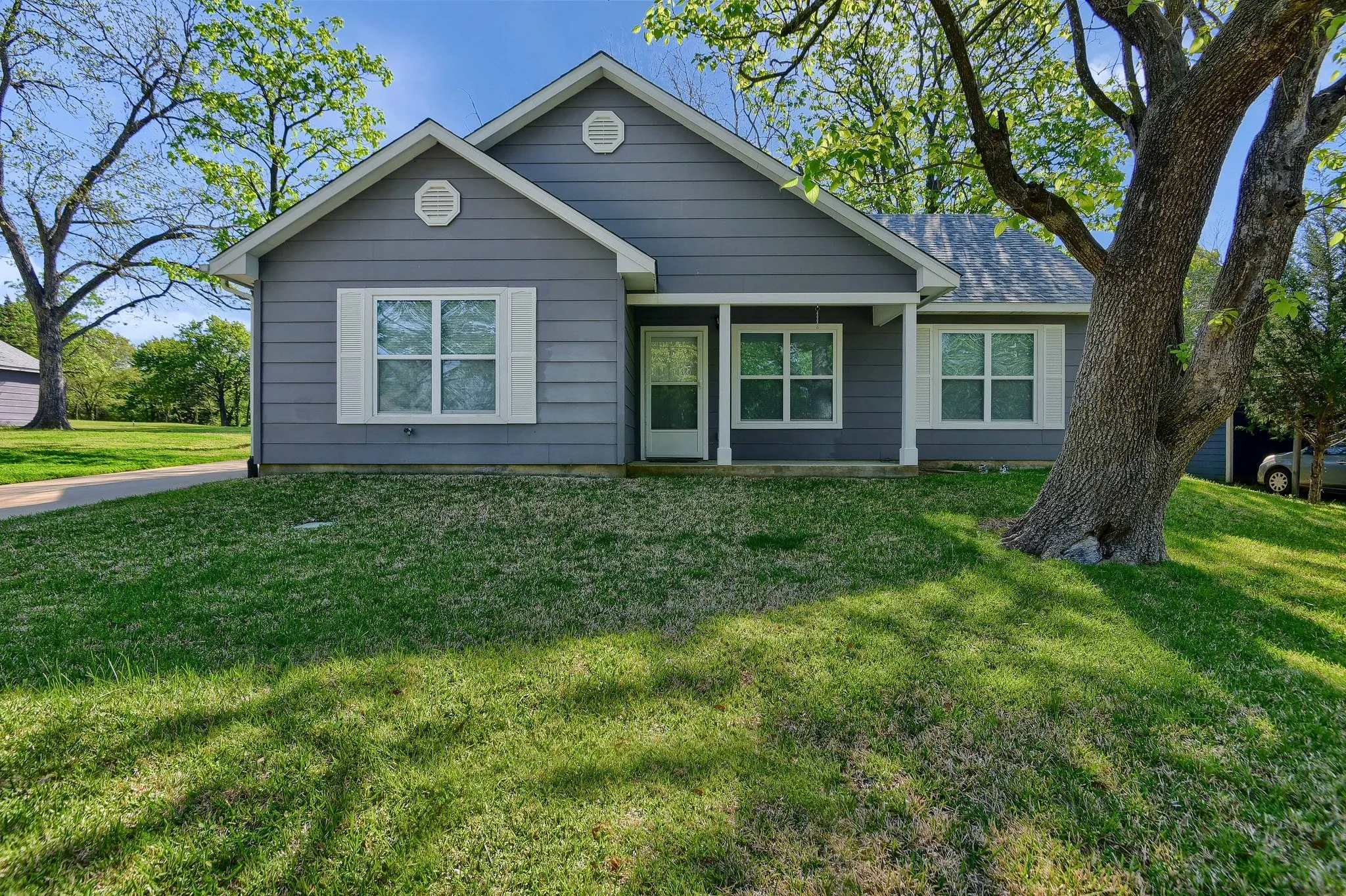 View of front of property with a front lawn