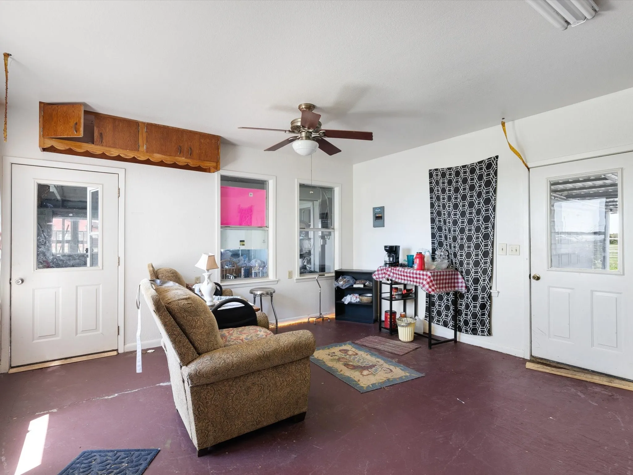 Living room featuring ceiling fan