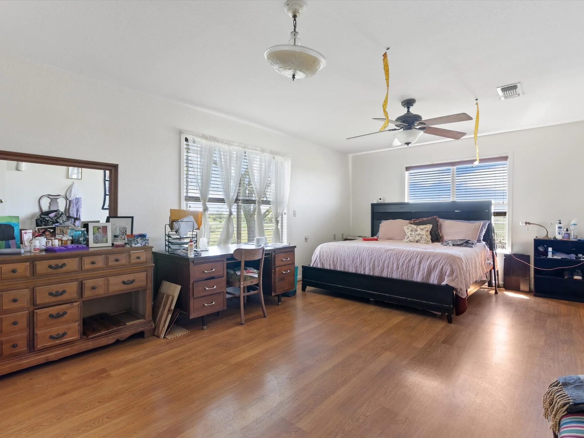 Bedroom with wood-type flooring and ceiling fan