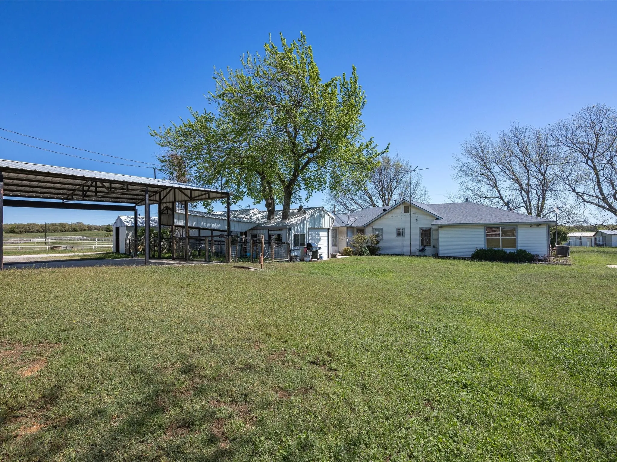 View of yard with a carport