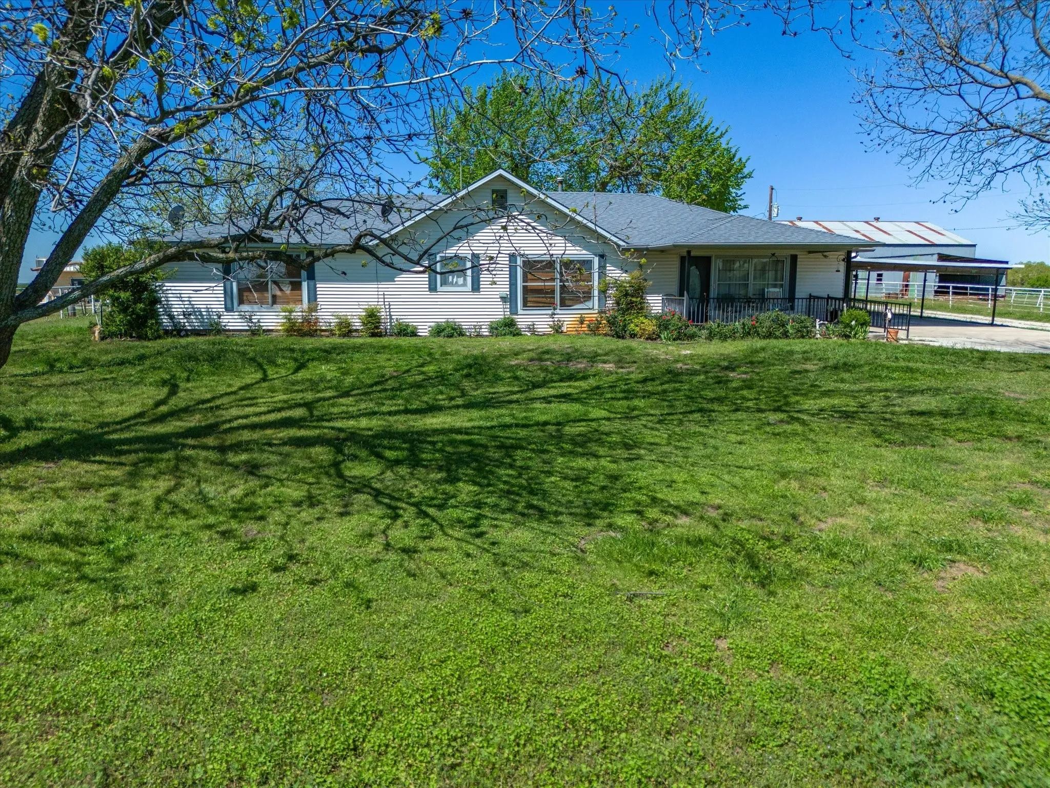 Ranch-style home with a front lawn