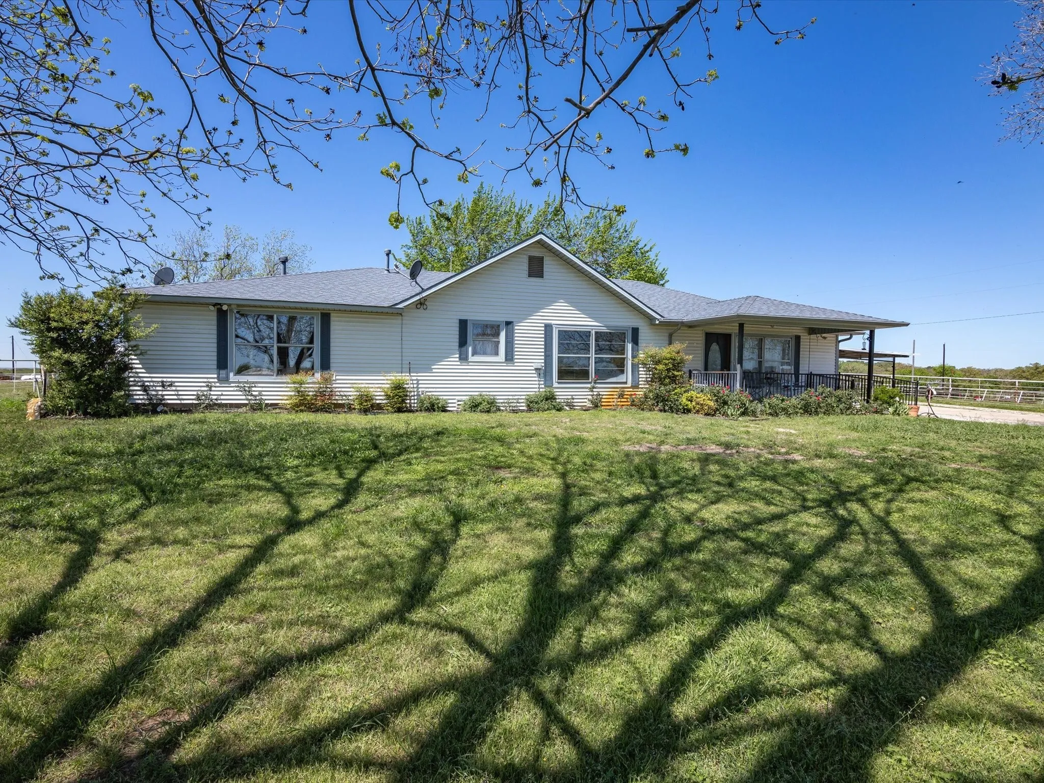 Rear view of property featuring a lawn