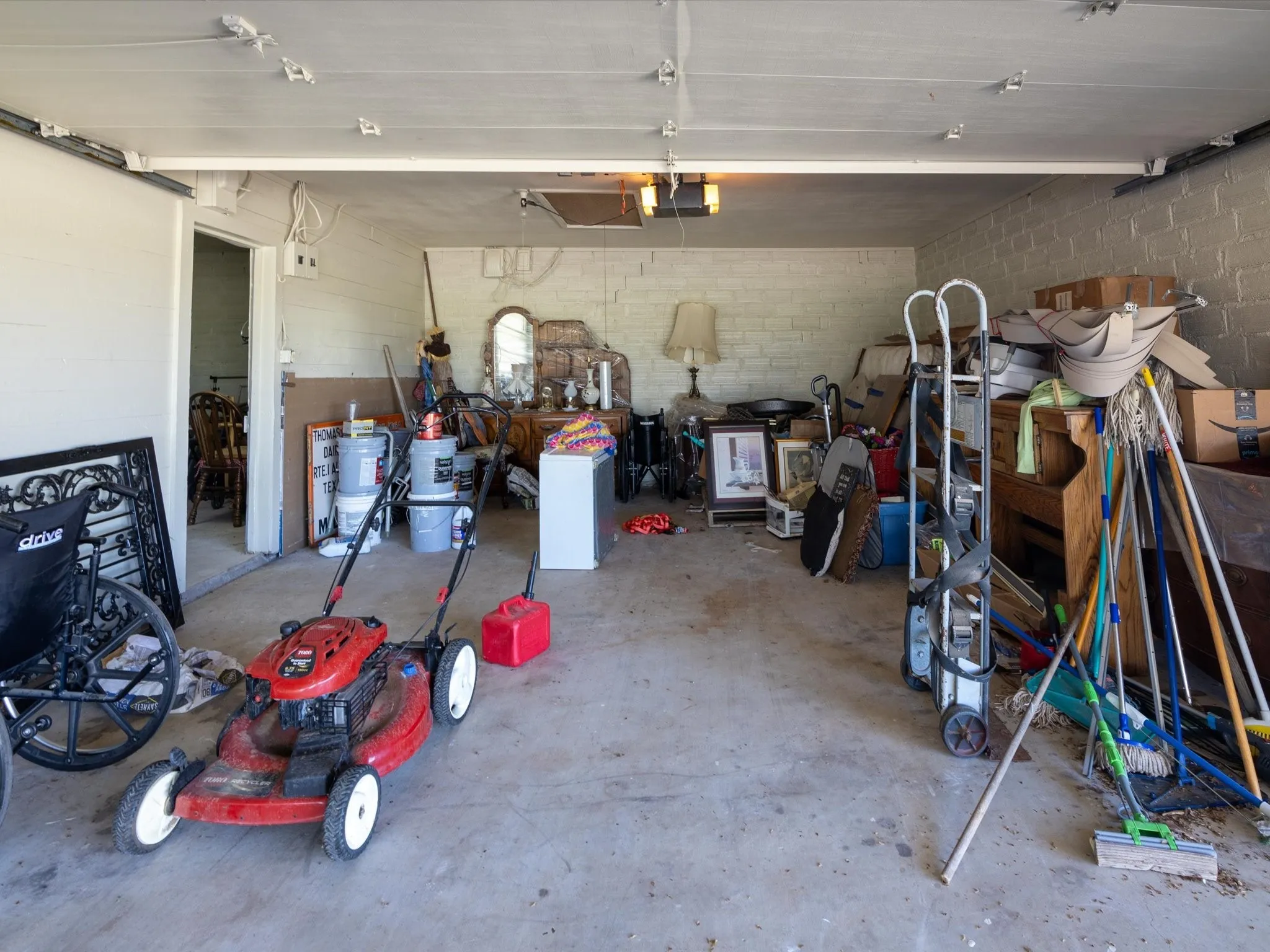 Garage featuring a garage door opener
