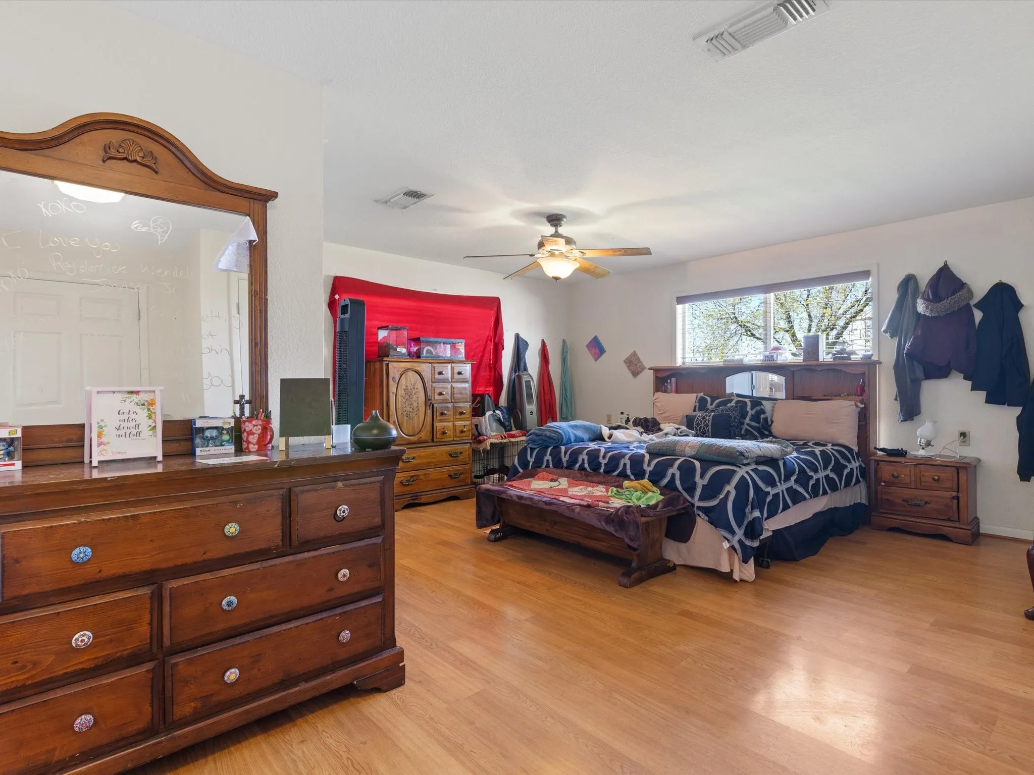 Bedroom featuring ceiling fan and light wood-type flooring