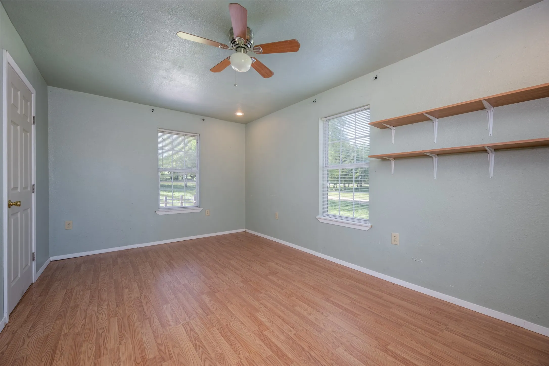 Guest house bedroom features plenty of windows too!