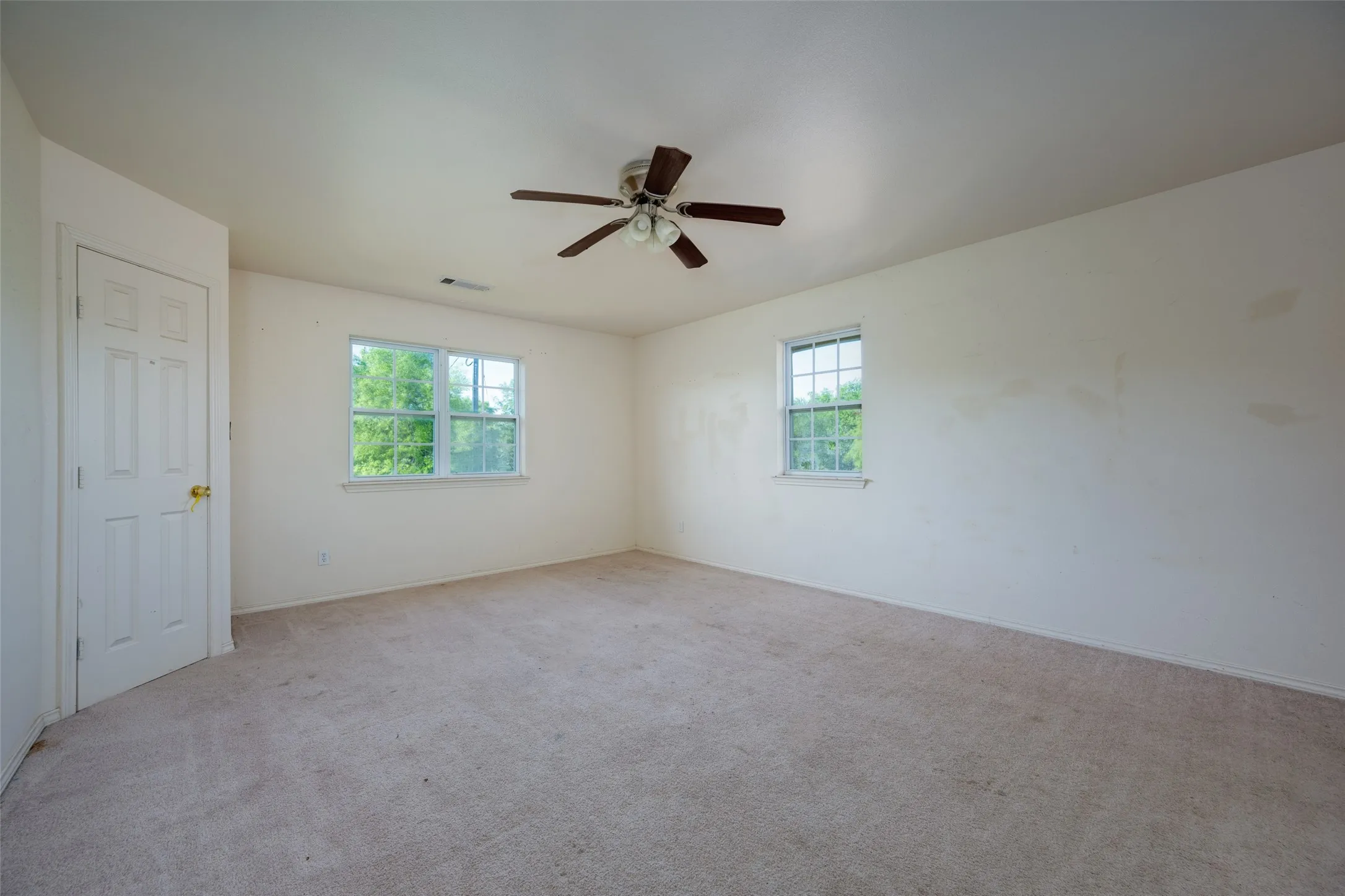 The primary suite will accomodate your king size furniture will room to spare.