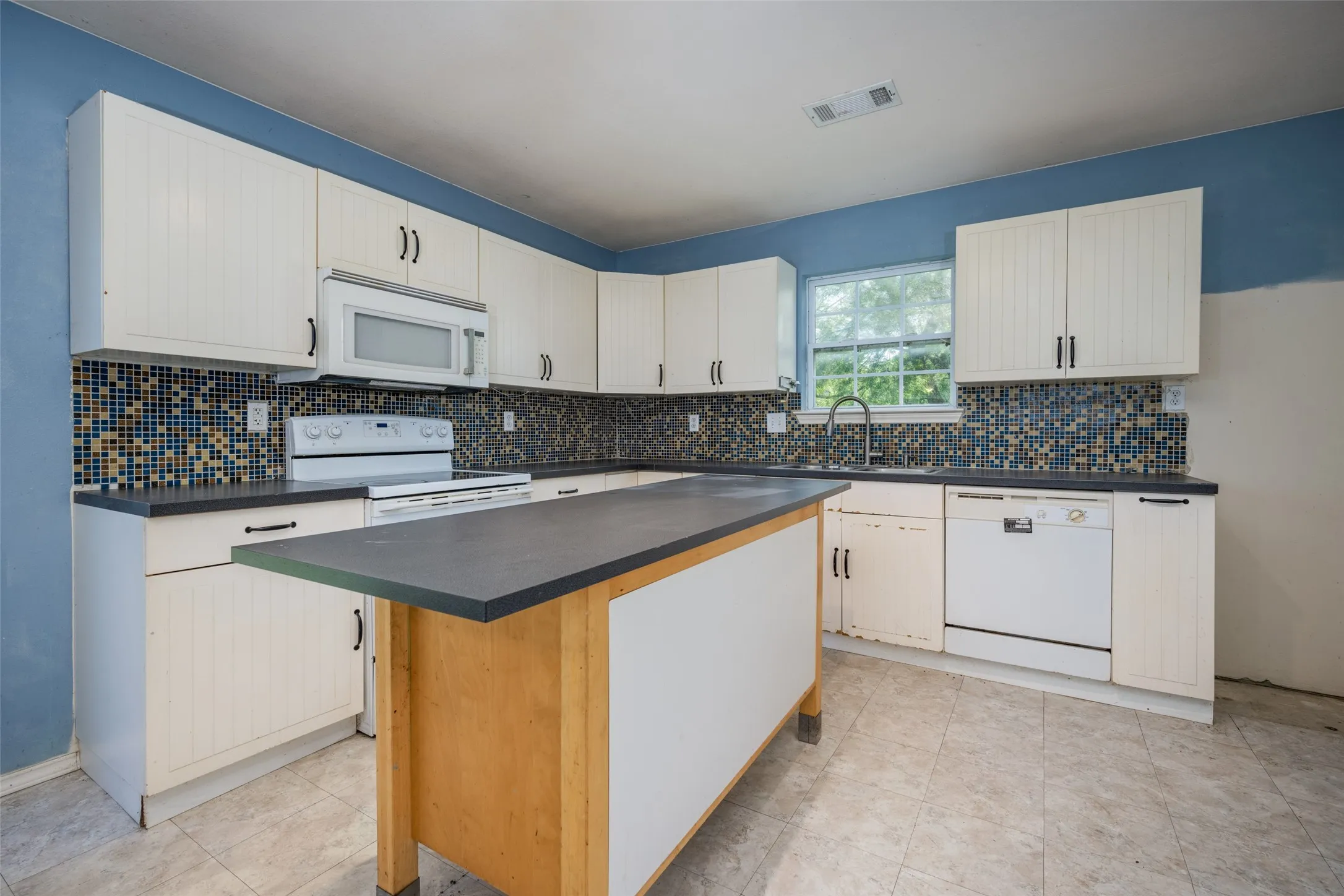 If you are needing storage space for all your kitchen gadgets, look at the cabinet space you'll have here