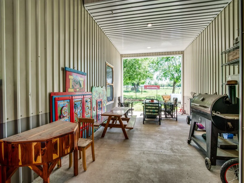 Breezeway with sitting area between main house and shop