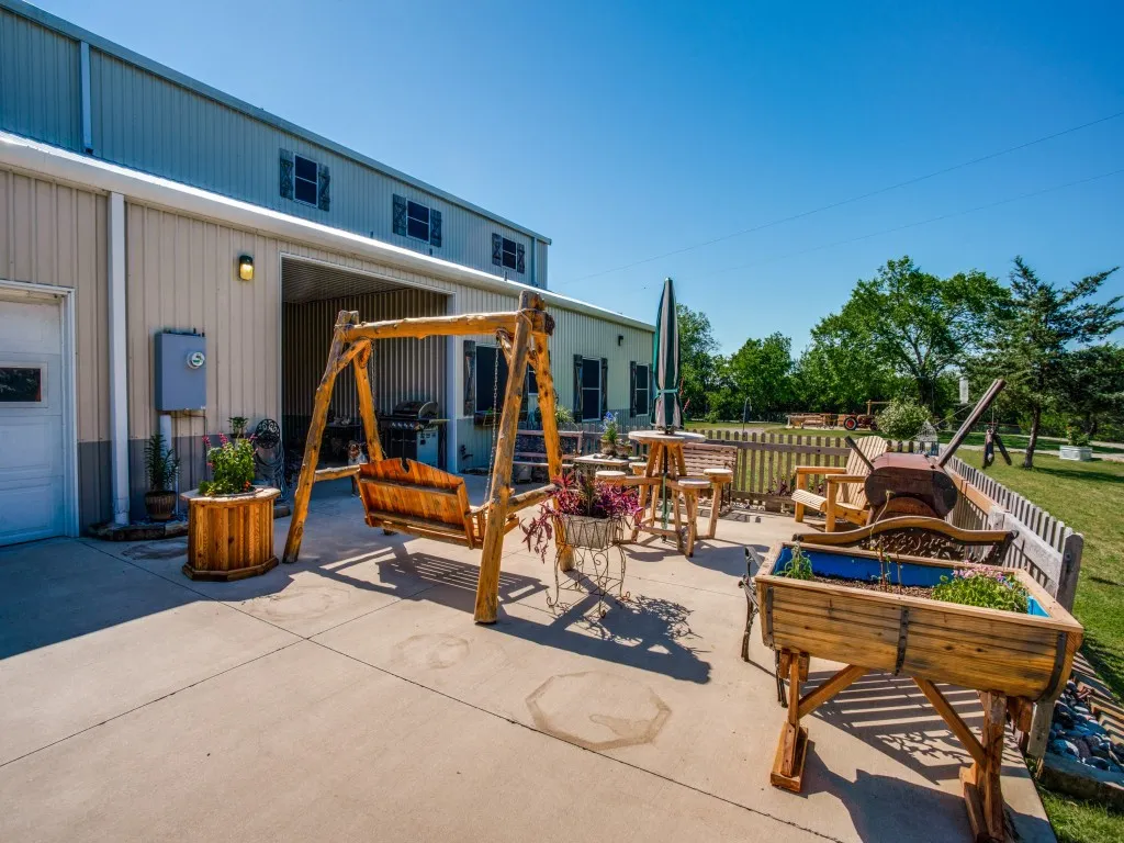 View of patio / terrace between home and attached shop